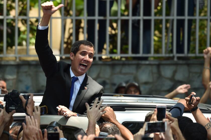 Venezuelan opposition leader and self-proclaimed interim president Juan Guaido gives the thumb up to supporters after giving details of what he calls "Operation Freedom" during a rally with local and regional leaders, in Caracas on March 27, 2019. - Desperation and rage spreads among Venezuelans as the hours pass and the massive blackout that hits the country since Monday is not solved. A new blackout swept across Venezuela on Monday, including much of Caracas, sowing alarm two weeks after a nationwide outage that paralyzed the country. (Photo by YURI CORTEZ / AFP)YURI CORTEZ/AFP/Getty Images ** OUTS - ELSENT, FPG, CM - OUTS * NM, PH, VA if sourced by CT, LA or MoD **