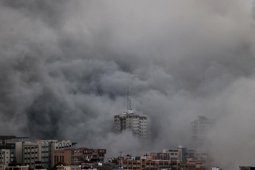 GAZA CITY, GAZA - OCTOBER 09: Smoke rises over the buildings as the Israeli airstrikes continue in Al-Rimal Neighbourhood of Gaza City, Gaza on October 9, 2023. (Photo by Ali Jadallah/Anadolu Agency via Getty Images)