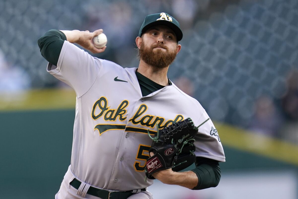 Oakland Athletics pitcher Paul Blackburn throws against the Detroit Tigers in the first inning of a baseball game in Detroit, Monday, May 9, 2022. (AP Photo/Paul Sancya)