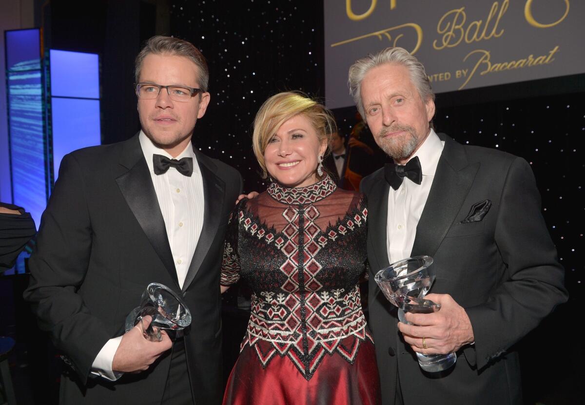 Matt Damon, left, Ghada Irani and Michael Douglas appear at the 2014 UNICEF Ball at the Beverly Wilshire Four Seasons Hotel.
