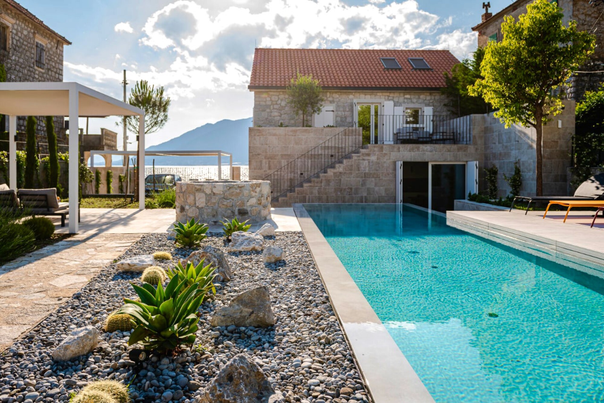 Waterfront villa with a swimming pool and panoramic view of the bay.