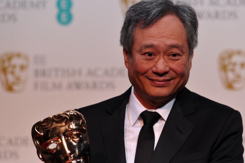 Ang Lee picks up the cinematography award for Claudio Miranda for his work on "Life of Pi" at the British Academy of Film and Television Arts Awards in London.