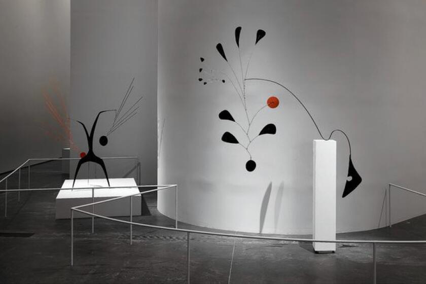 Frank Gehry's unobtrusive installation design helps set the stage for Calder’s intricately curved works.