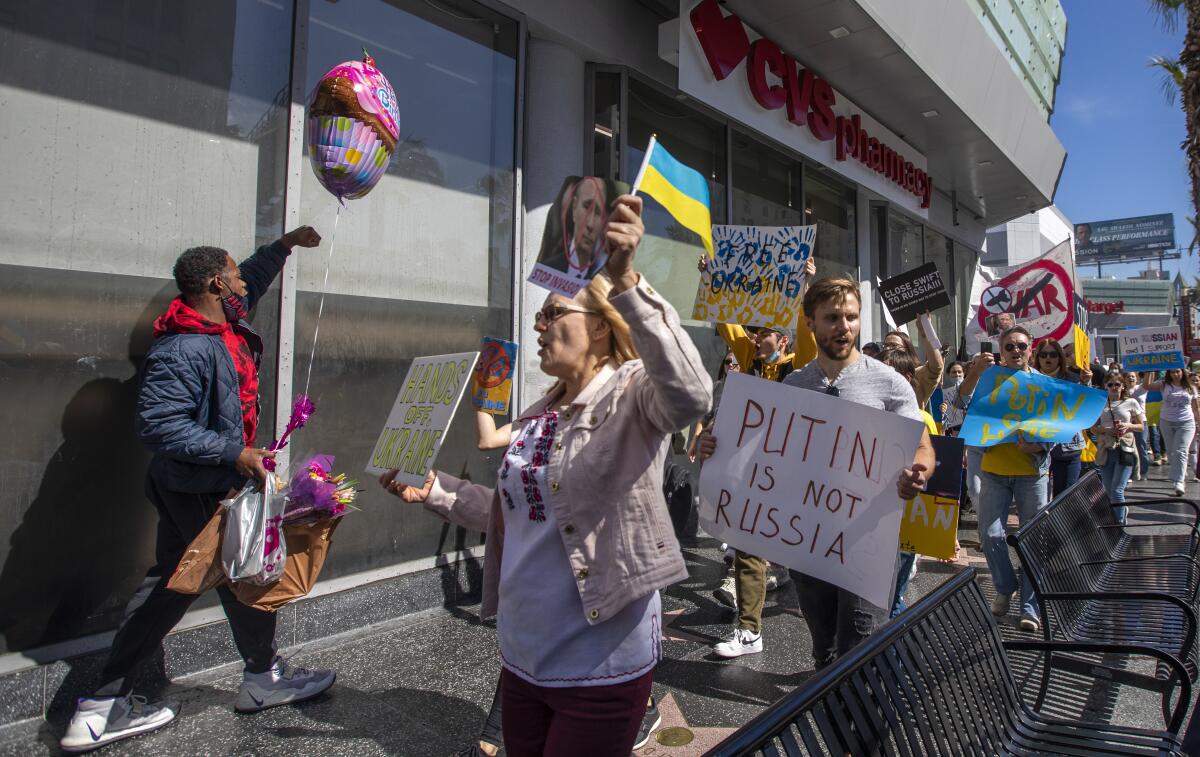 Members of the Ukranian community walk several miles demonstrating.