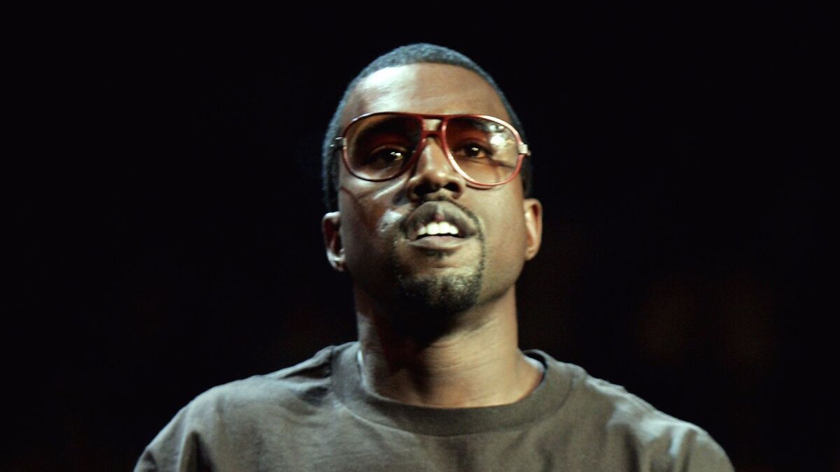 Singer Kanye West was arrested Sept. 11, 2008, at Los Angeles International Airport after an altercation with a photographer. (Jeff Christensen / Associated Press)
