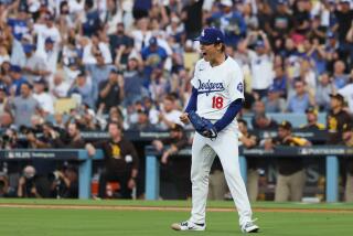 LOS ANGELES, CALIFORNIA - OCTOBER 11: Yoshinobu Yamamoto #18 of the Los Angeles Dodgers.