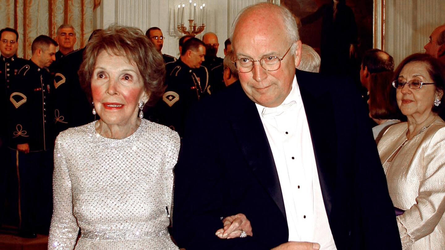 Vice President Dick Cheney escorts the former first lady at a white-tie dinner for Britain's Queen Elizabeth II at the White House in May 2007.