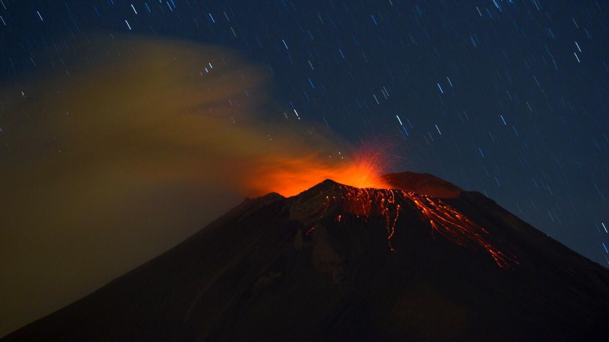 In 2012 photograph, Mexico's Popocatepetl volcano lights up the night sky.