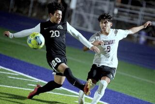 Fremont winger Joshua Valenzuela crosses the ball into the penalty area in front of Marquez defender Henry Gonzalez