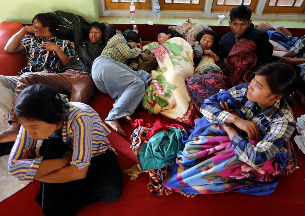 Residents of the Kokang region of Myanmar who fled the fighting there take shelter in a monastery set up as a temporary refugee camp in Lashio, Myanmar, on Feb. 19.