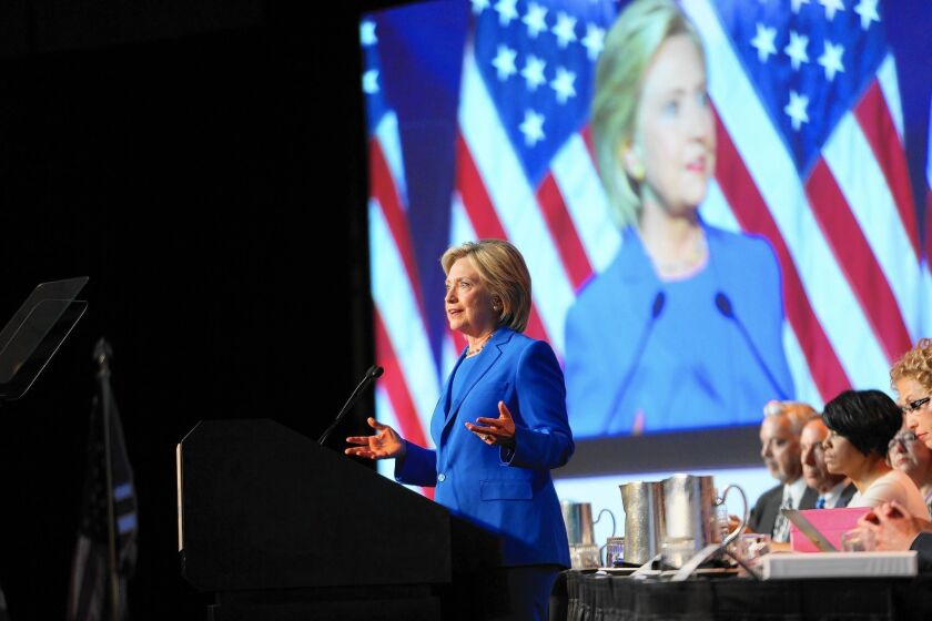 Presidential candidate Hillary Rodham Clinton speaks at the Democratic National Committee summer meeting in Minneapolis.