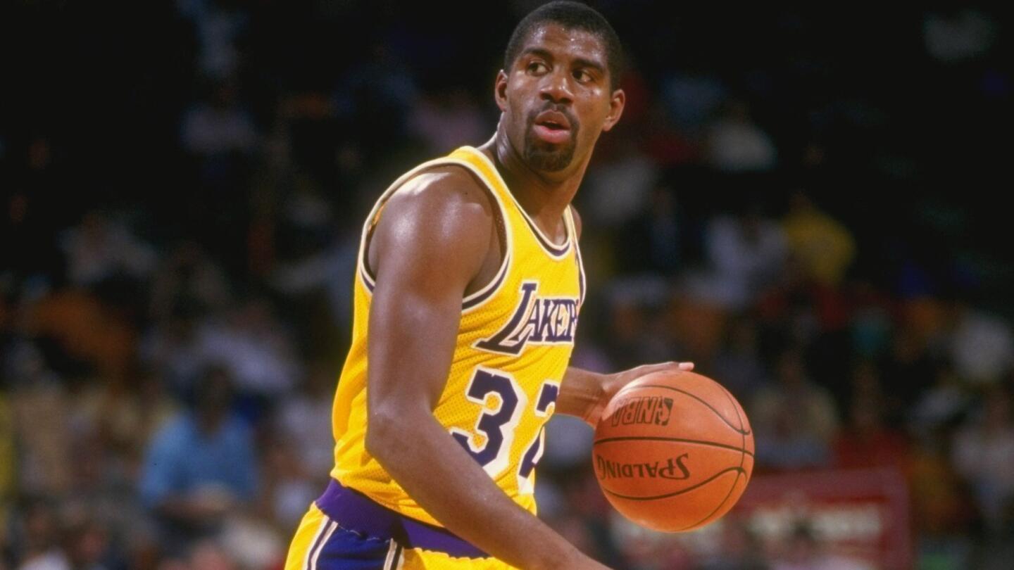 Lakers star Magic Johnson dribbles the ball during a game at the Forum in 1987.