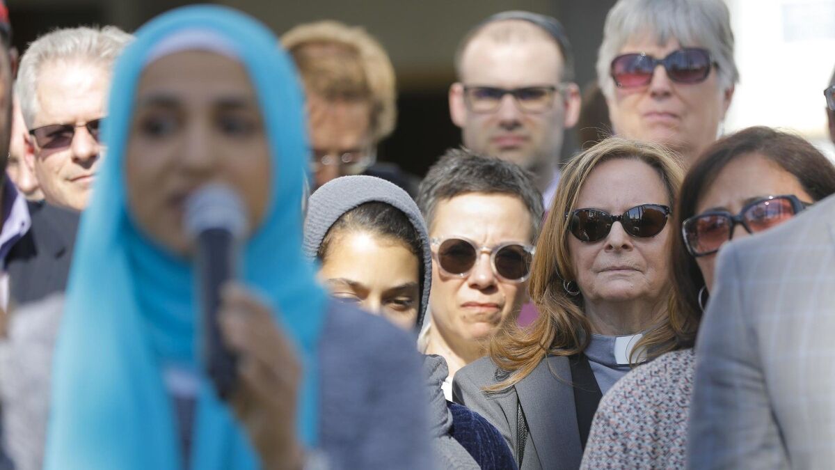 Interfaith and community organization leaders held a news conference at the Islamic Center of San Diego to denounce hate and the mass shootings at two mosques in New Zealand.