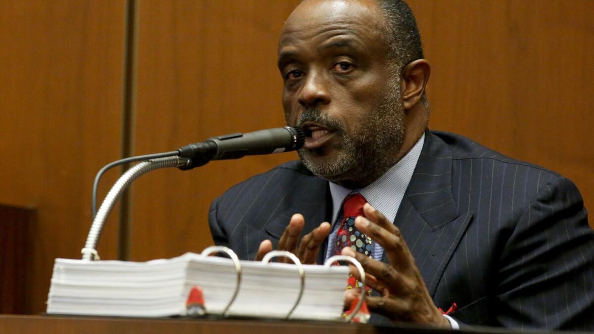Then-state Sen. Roderick D. Wright takes the stand in his own defense at a 2014 trial, in which he was convicted of lying about living in his legislative district.