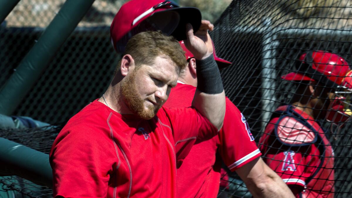 Angels right fielder Kole Calhoun exits the cage after taking his swing during batting practice on Feb. 28 in Tempe, Ariz.