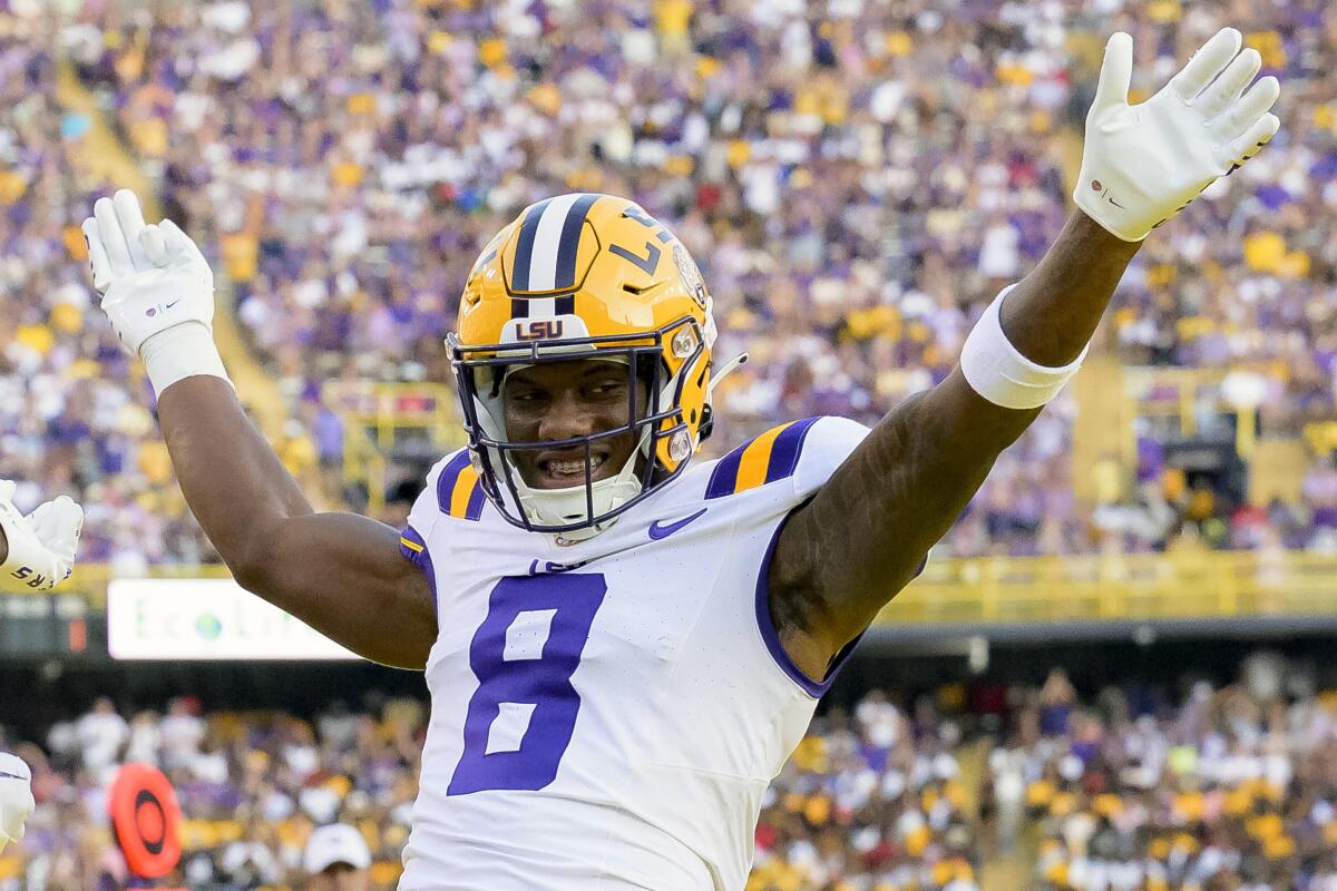Louisiana State receiver Malik Nabers (8) celebrates after a touchdown.