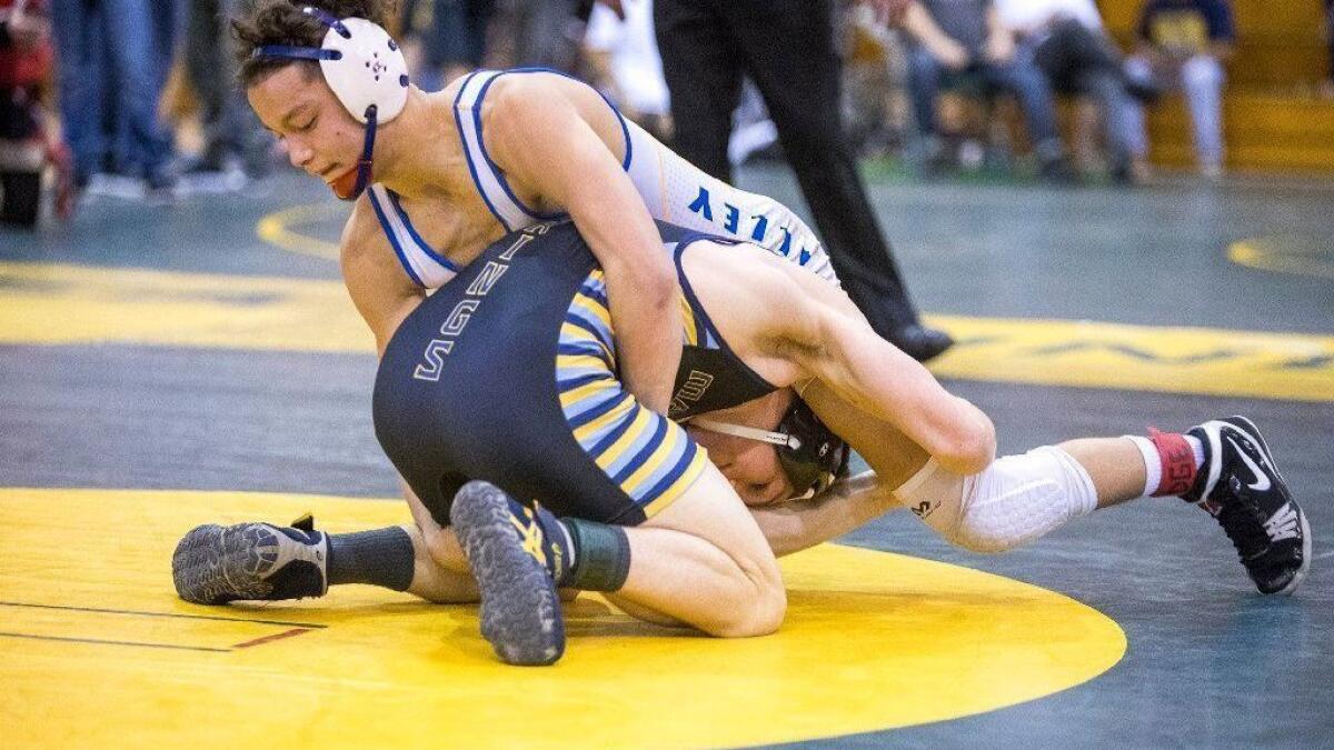 Max Wilner, seen competing on top for Fountain Valley High in the CIF Southern Section Southern Division championships on Feb. 17, 2018, is ranked fifth in the state for 160-pound wrestlers.