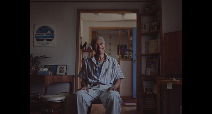 A man seated in a chair in the documentary "Keyboard Fantasies."