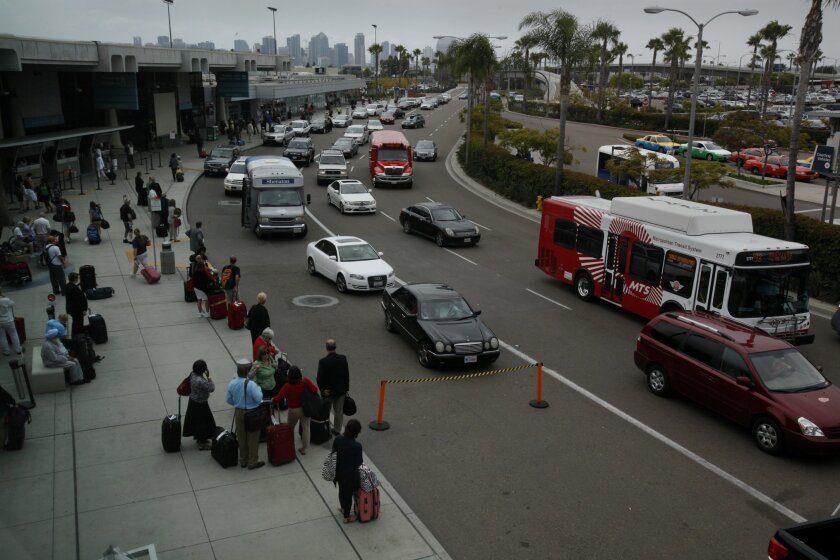 Traffic of cars and travelers at San Diego's airport.