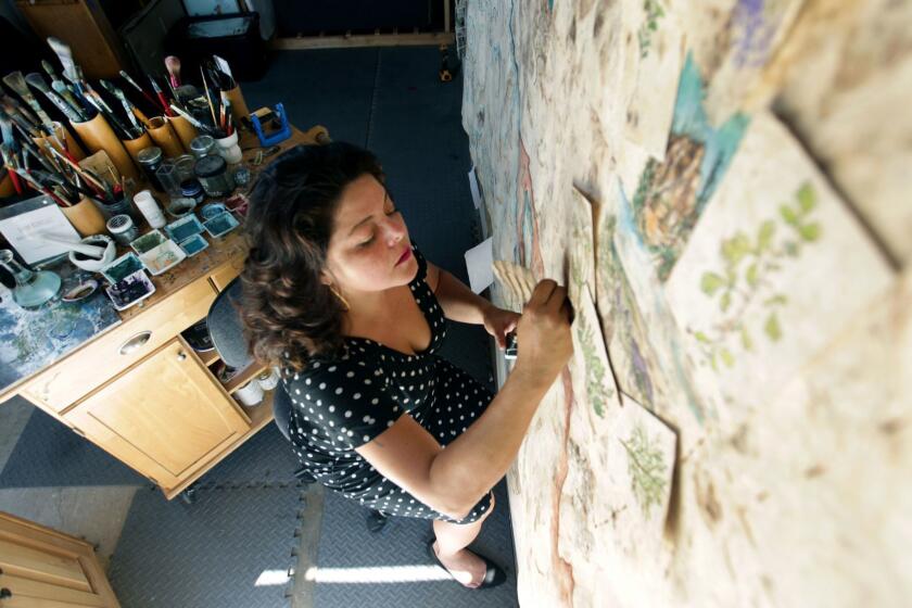 LOS ANGELES, CA., OCTOBER 1, 2018 --- In creating her large scale paintings, artist Sandy Rodriguez turns to the past, employing handmade papers crafted from bark and hand-ground pigments made from cochineal. She uses these to create works inspired by Mayan and colonial codices, but that are contemporary in nature ? touching on politics, immigration, deportation and, now, child separation. The artist will be the subject of exhibitions at the Municipal Art Gallery and the Riverside Art Museum in October and November. (Kirk McKoy / Los Angeles Times)