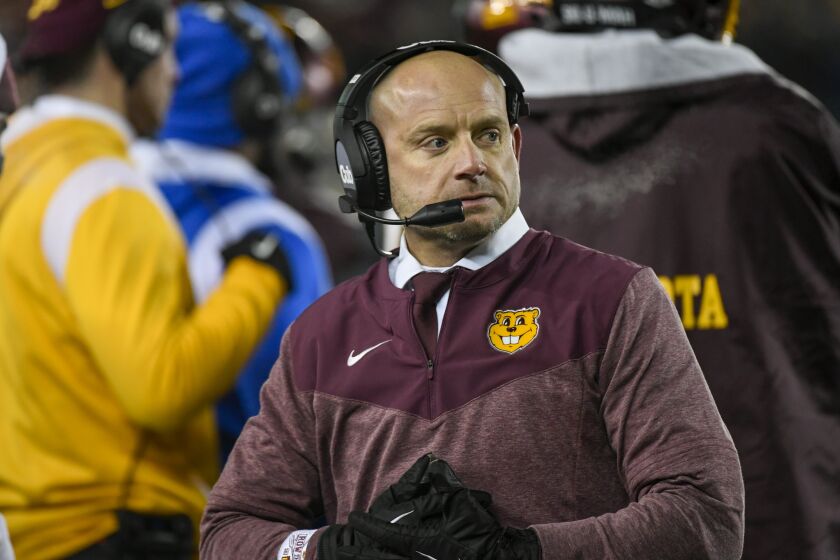 Minnesota head coach P.J. Fleck waits as referees review a play during an NCAA college football game against Iowa in the second half Saturday, Nov. 19, 2022, in Minneapolis. (AP Photo/Craig Lassig)