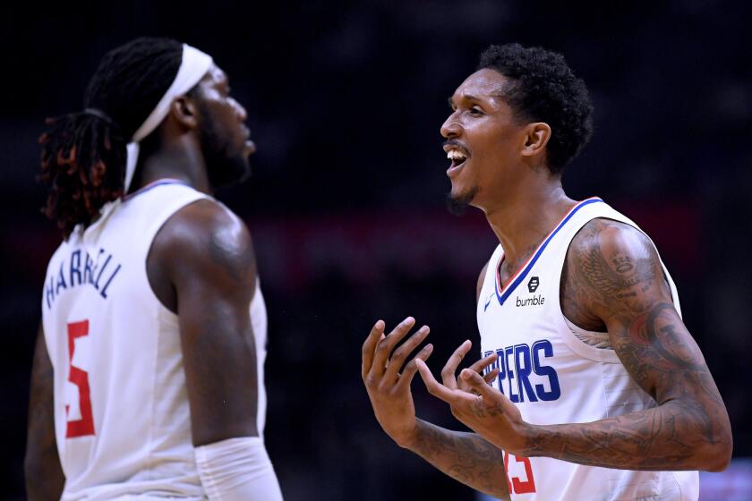 Clippers guard Lou Williams (23) reacts to a foul call alongside teammate Montrezl Harrell during a game against the Hawks on Jan. 28 at Staples Center.
