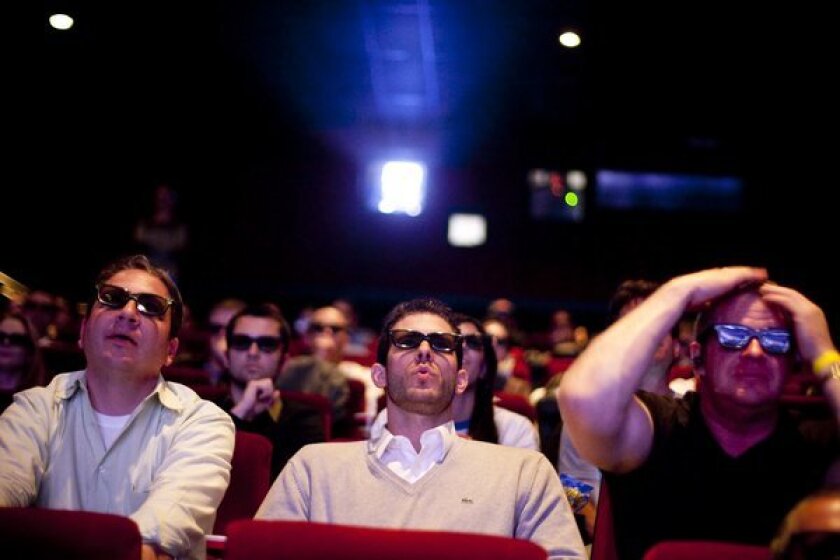 Moviegoers watch a live 3-D broadcast of the men's NCAA National Basketball Championship at the former Mann's Chinese 6 Theatres in the Hollywood and Highland Center. One of the theaters in the complex will have a comedy club.