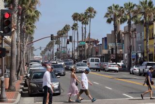 July 20, 2017_Oceanside, California_USA_| Pedestrians cross Coast Highway at Pier View Way in downtown Oceanside. It's one of the intersections the City is considering for a roundabout. |_Photo Credit: Photo by Charlie Neuman
