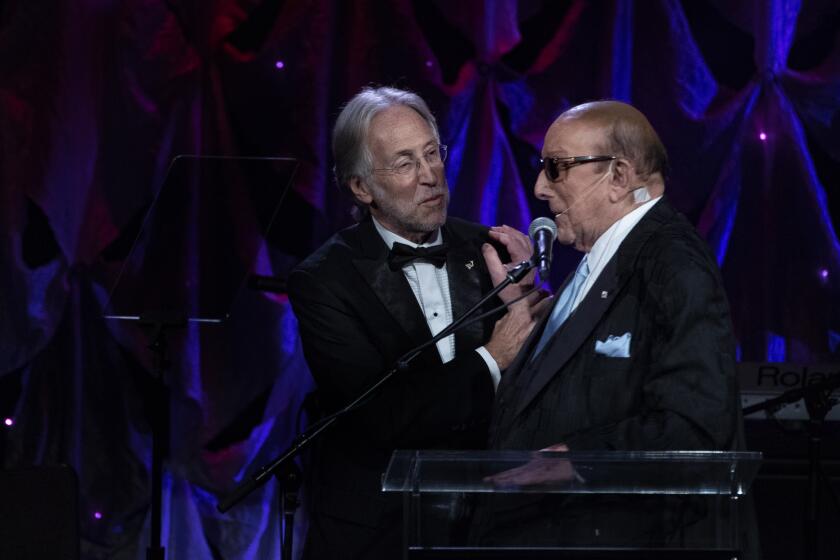 Recording Academy President Neil Portnow, left, and Clive Davis at the record executive’s annual pre-Grammy gala Saturday at the Beverly Hilton.