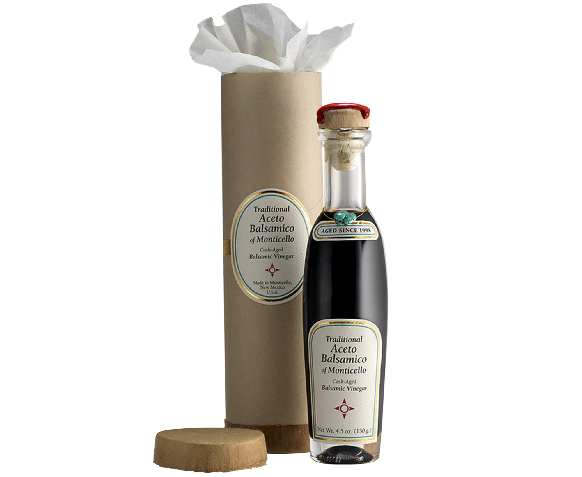 A bottle of aceto balsamico of Monticello sits next to its packaging