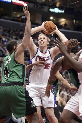 Clippers' Chris Kaman goes up against Boston's Ryan Gomes.