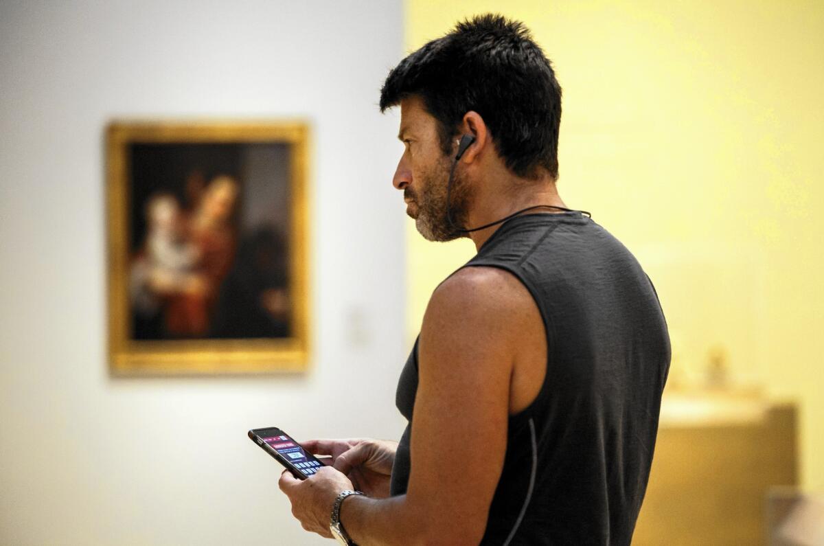 Kenny Weissman from New York City visits LACMA and uses the museum's mobile app on Oct. 13, 2015.