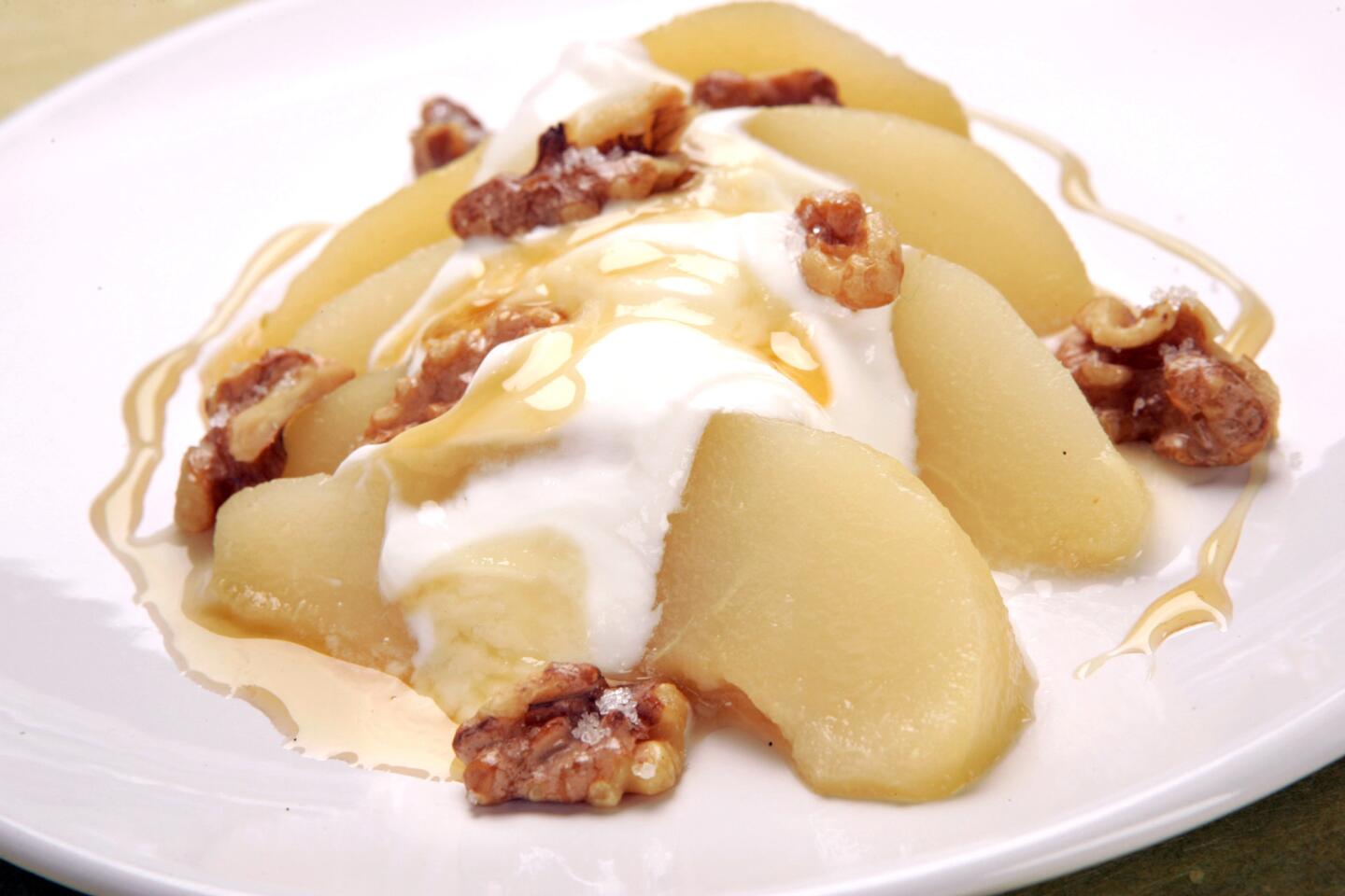 Honey-poached pear with Greek yogurt and toasted walnuts