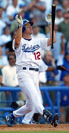 #2 Dodger homer on Bill Plaschke's list: Steve Finley tosses his bat after hitting a grand slam in the bottom of the ninth inning against the San Francisco Giants in 2004 to give the Dodgers a 7-3 victory and their first postseason berth since 1996.