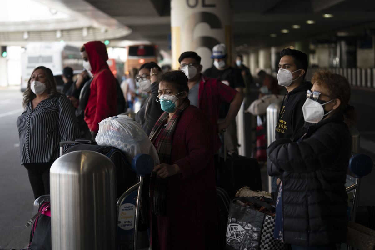 Travelers at Los Angeles International Airport.