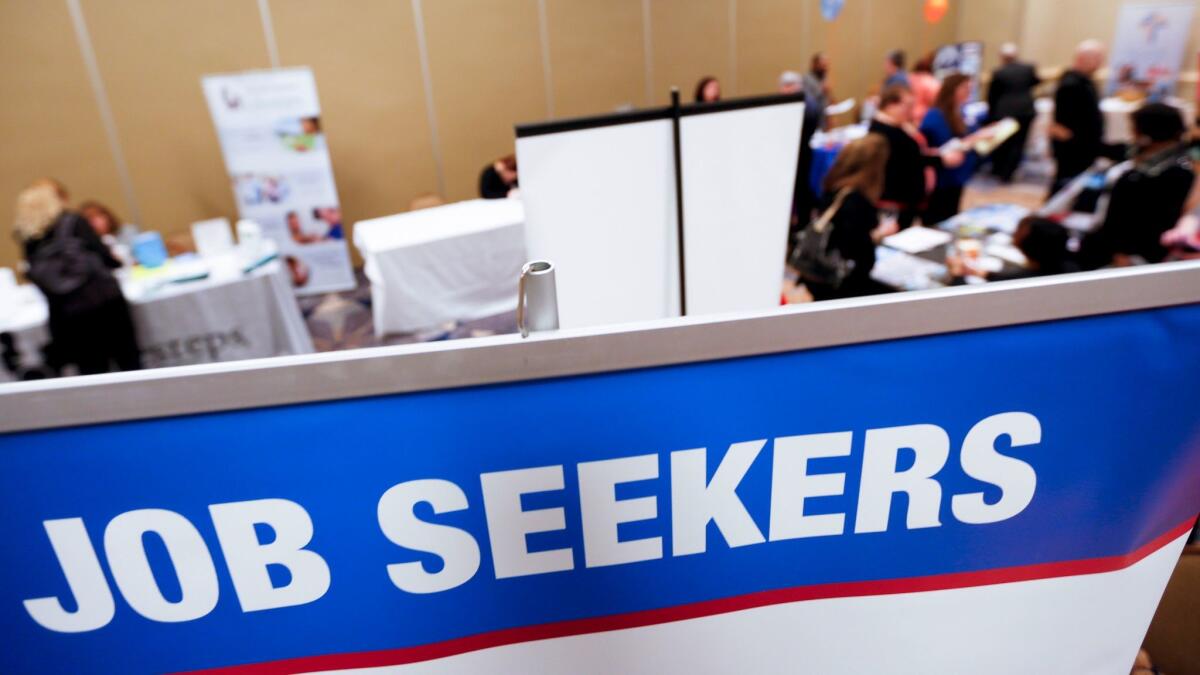 Employment seekers attend a jobs fair in Pittsburgh in March 2016. The Labor Department reported Friday that the unemployment rate dipped to 4.7% from 4.8% as employers added 235,000 workers.
