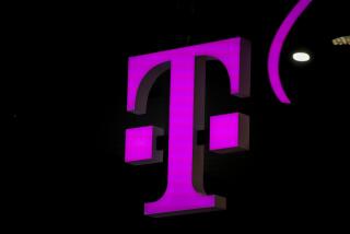 FILE - T-mobile logo in the Mobile World Congress 2023 in Barcelona, Spain, on Thursday, March 2, 2023. On Tuesday, May 28, 2024, T-Mobile is buying U.S. Cellular's wireless operations and certain spectrum assets in a deal valued at $4.4 billion. (AP Photo/Joan Mateu Parra, File)