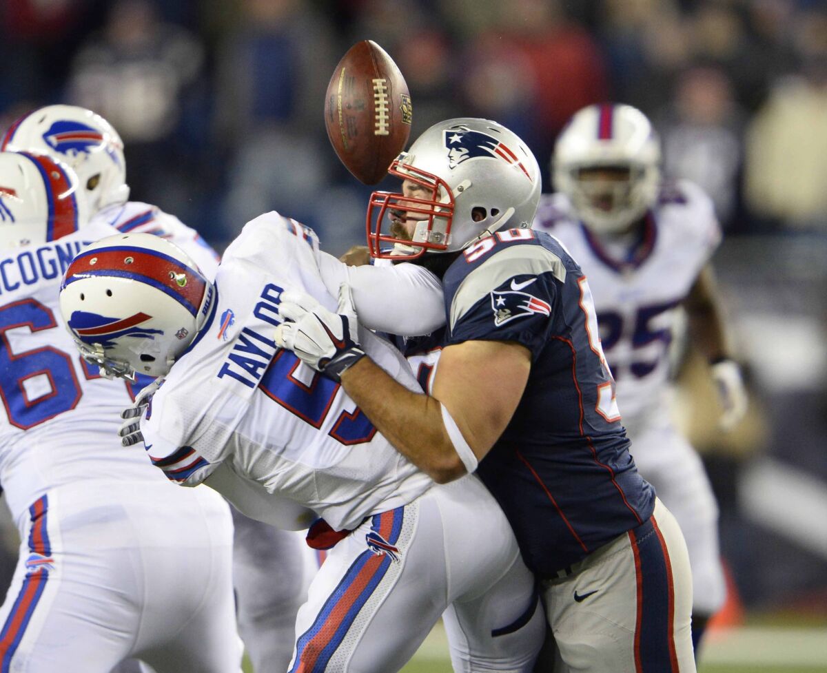 Patriots defensive end Rob Ninkovich sacks Bills quarterback Tyrod Taylor, causing him to fumble, during a game last season.