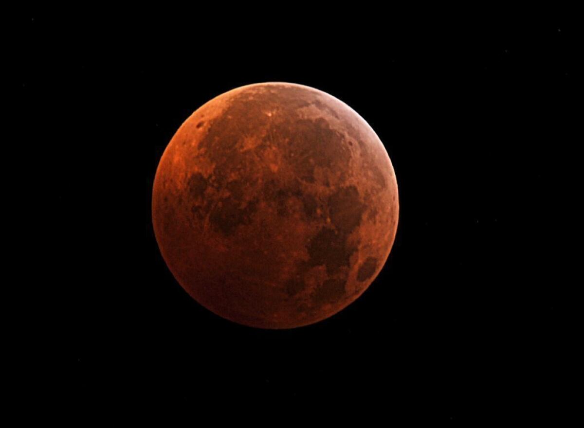 The moon during the peak of a total eclipse on Dec. 21, 2010. It will take on this color again in a series of total eclipses beginning April 14.