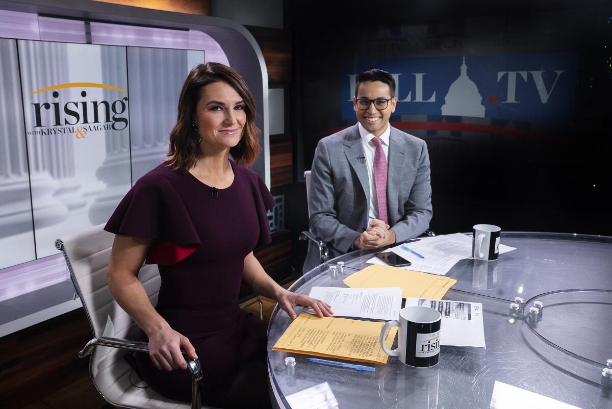 "Rising" hosts Krystal Ball and Saagar Enjetti.