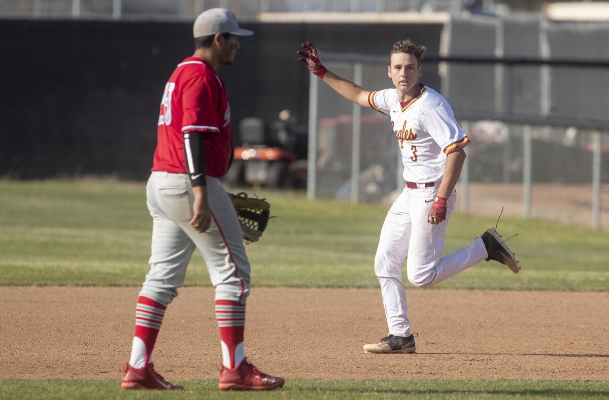 Estancia's Garrett Palme celebrates after his walk-off hit in the bottom of the eighth inning lifted the Eagles to a 1-0 win over Savanna in the first round of the CIF Southern Section Division 5 playoffs at home on May 2, 2019.