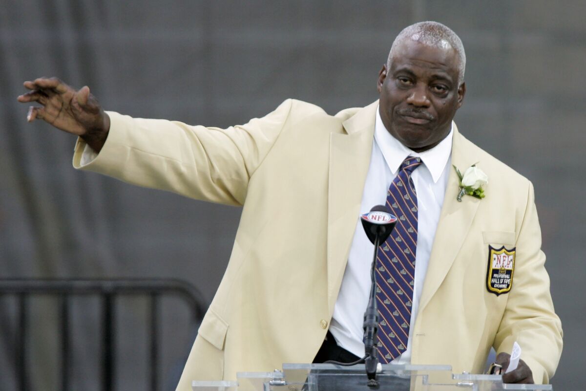 Fred Dean waves to fans after his speech in 2008 at the Pro Football Hall of Fame, in Canton, Ohio. 