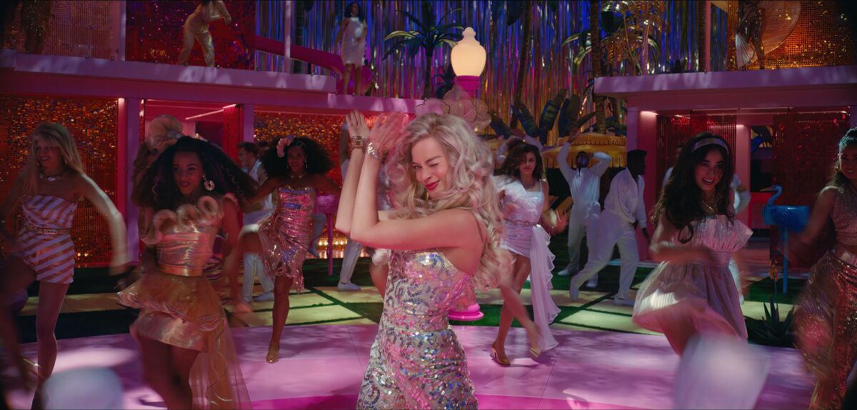 Women dancing in a pink disco