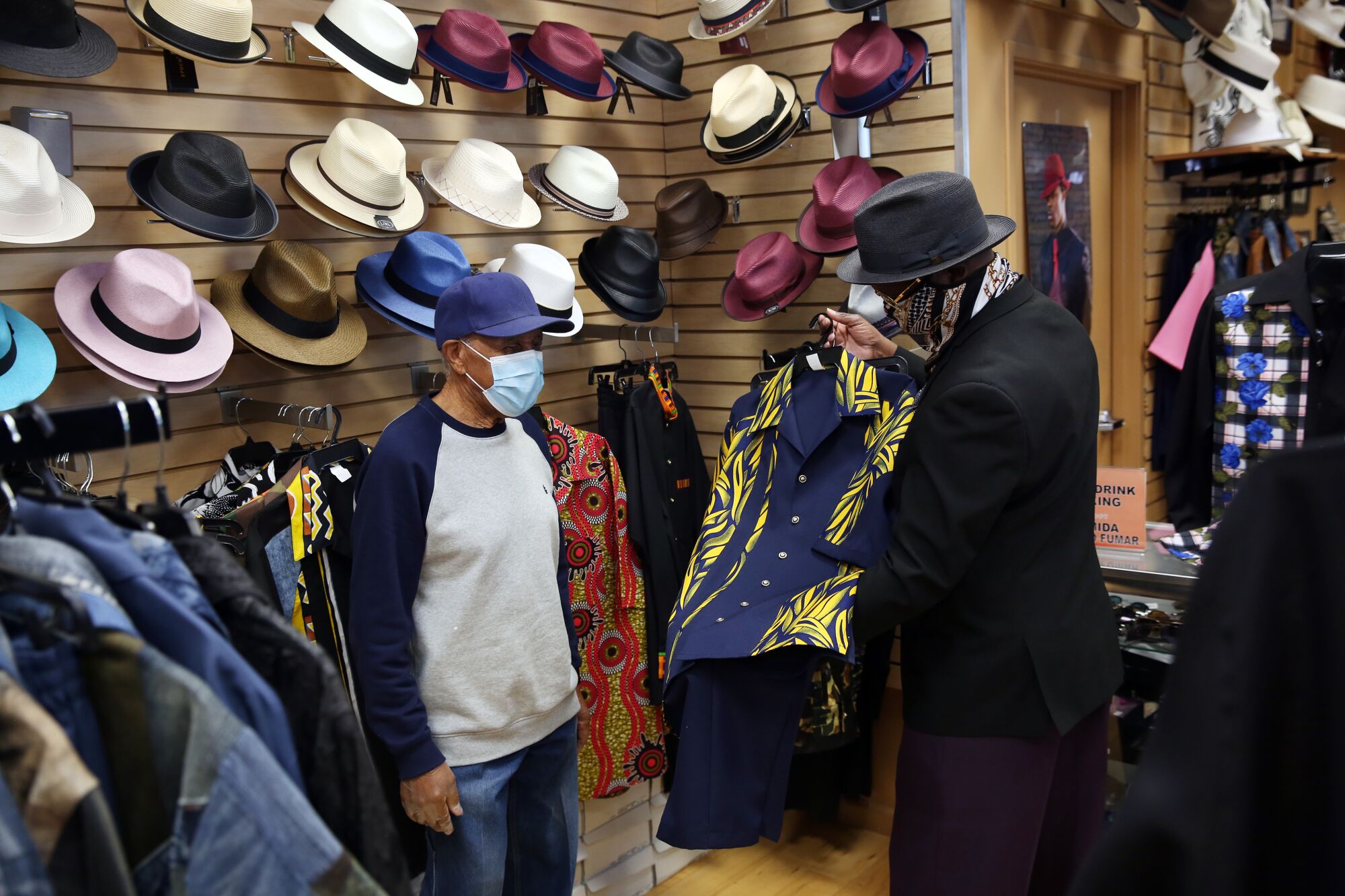 Joseph Cooney, left, is assisted by James Brumfield of James Brumfield Designs.