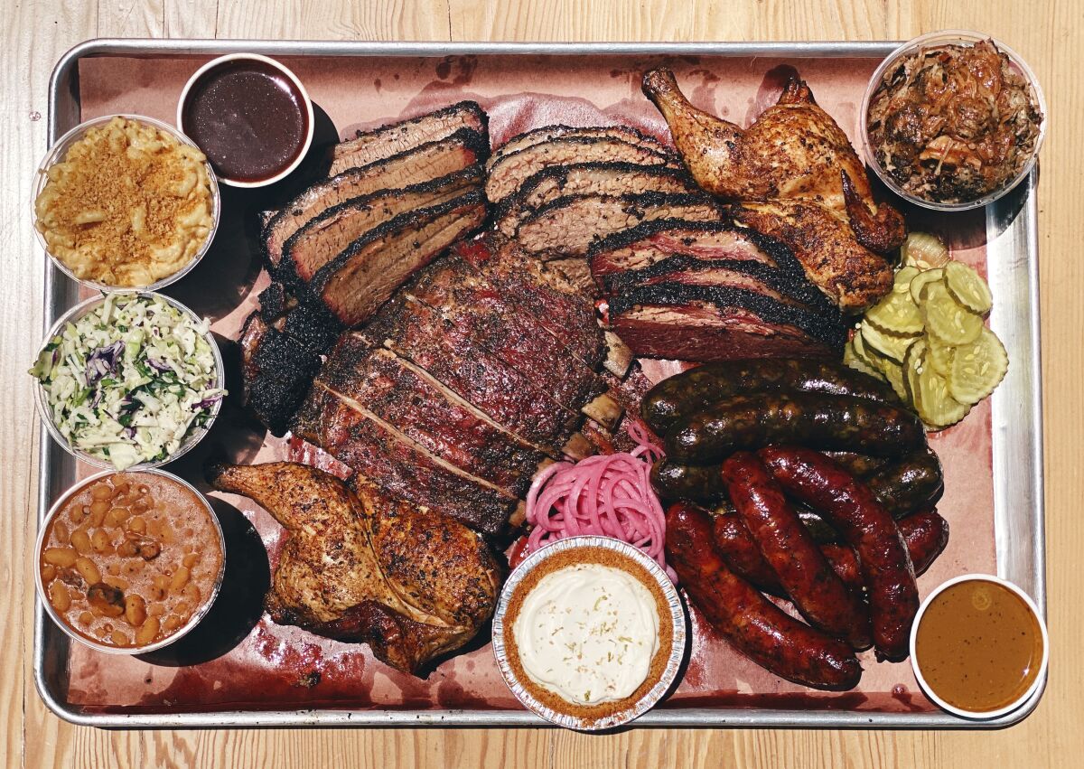 A tray of meats and sides from Moo's Craft Barbecue.