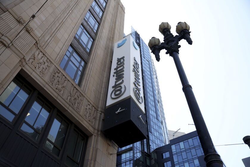 FILE - A sign is pictured outside the Twitter headquarters in San Francisco, Monday, April 25, 2022. Trading in shares of Twitter were halted, Tuesday, Oct. 4, after the stock spiked on reports that Elon Musk would proceed with his $44 billion deal to buy the company after months of legal battles.(AP Photo/Jed Jacobsohn, File)