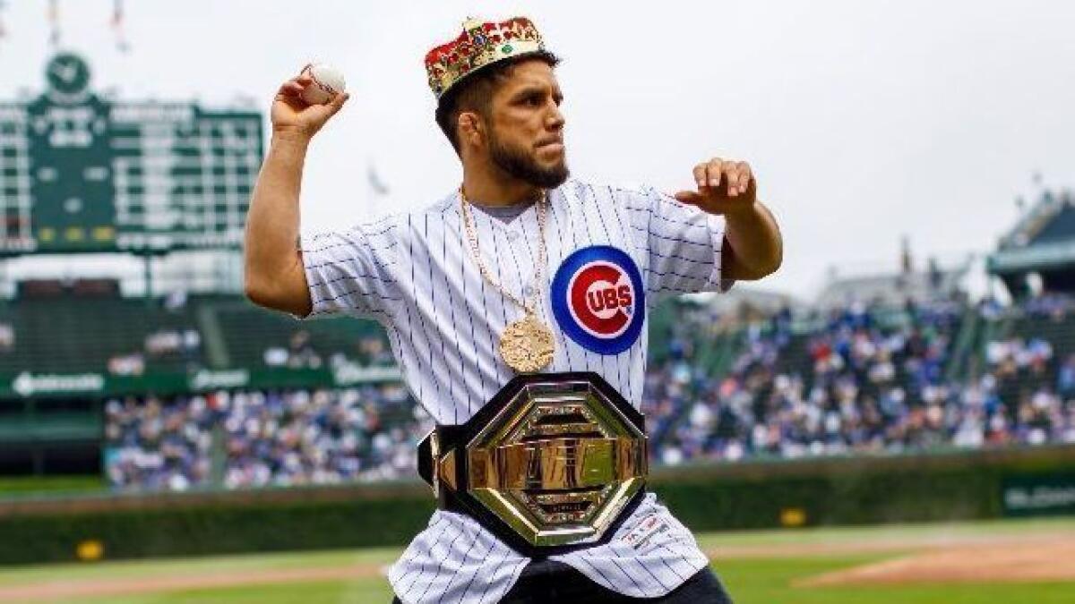 Henry Cejudo throws out the first pitch before the Chicago Cubs game on Thursday.