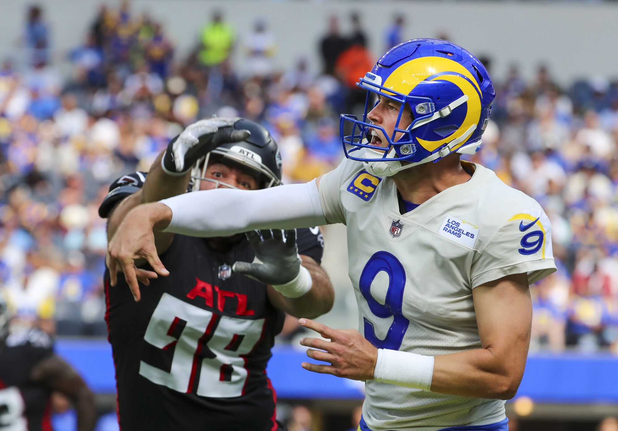 Falcons defensive lineman Abdullah Anderson pressures Rams quarterback Matthew Stafford.