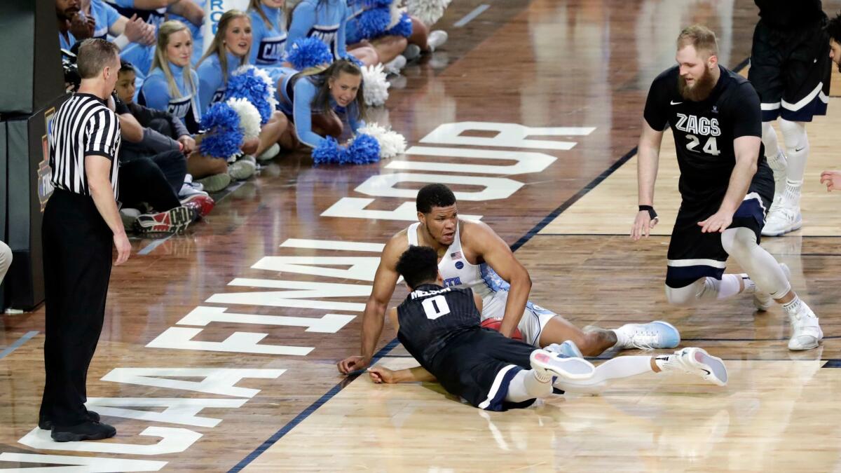 North Carolina's Kennedy Meeks places his right hand out bounds as he battles Gonzaga's Silas Melson for a loose ball during the final minute of the NCAA championship game on April 3.