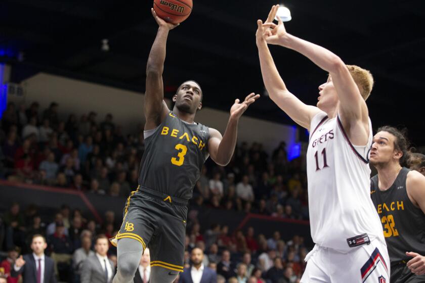 Long Beach State guard Drew Cobb (3) goes up for a shot over Saint Mary's forward Matthias Tass (11) during the first half of an NCAA college basketball game Thursday, Nov. 14, 2019, in Moraga, Calif. (AP Photo/D. Ross Cameron)